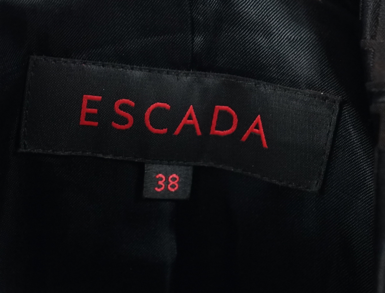 A Escada lady's monogram black trench coat, size 38